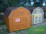 Lofted barns in cedar and tan